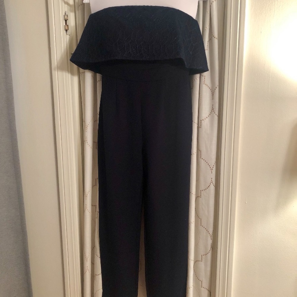 Navy jumpsuit w peplum top. Ankle /straight cut